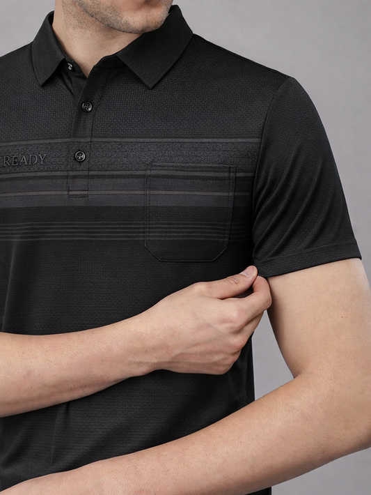 Black polo shirt with textured pattern on a gray background
