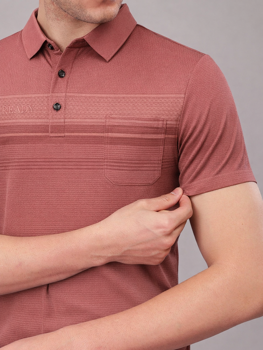 Close-up of a person wearing a maroon textured polo shirt with 'King & Young' branding.
