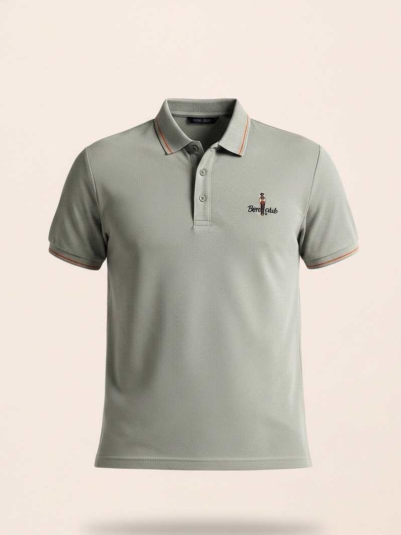 Gray polo shirt with a small logo on a beige background