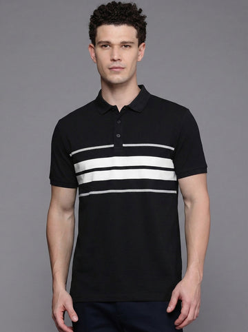 Man wearing a black polo shirt with white stripes on a gray background