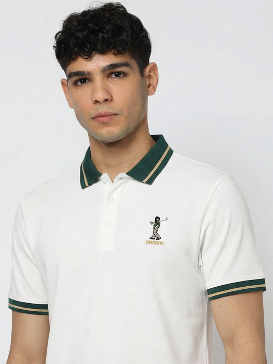 Man wearing a white polo shirt with green accents and a logo on a plain background