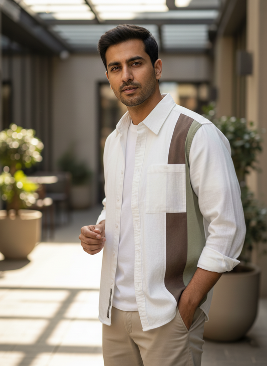 Man wearing a white shirt with a brown vest in an outdoor setting