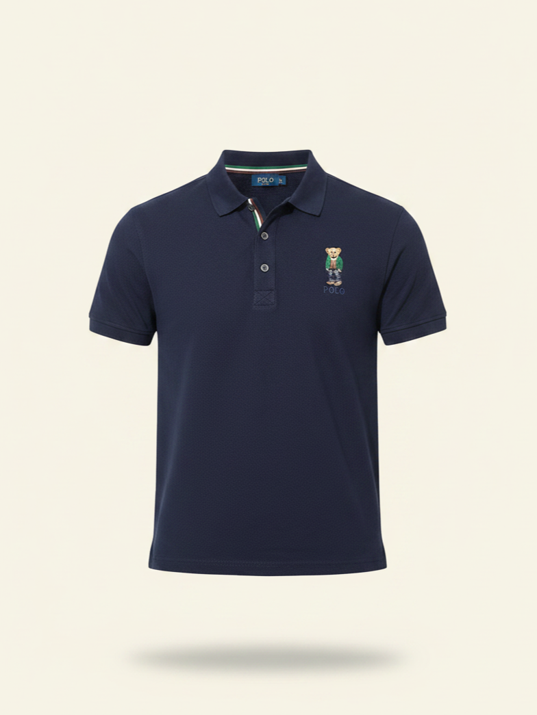Navy blue polo shirt with a logo on a beige background