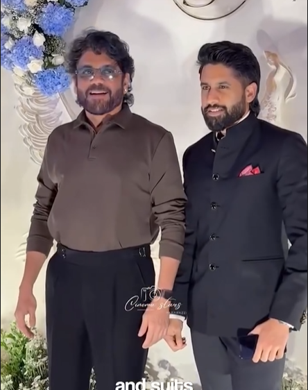 Two men standing side by side with a decorated background