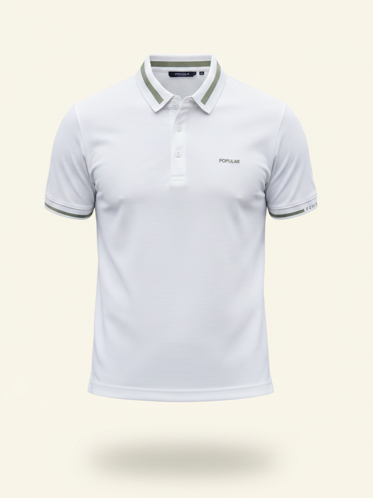 White polo shirt with green trim on a light beige background