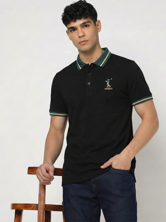 Man wearing a black polo shirt with a logo on a white background