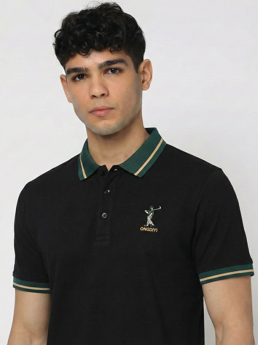 Man wearing a black polo shirt with a logo on a white background