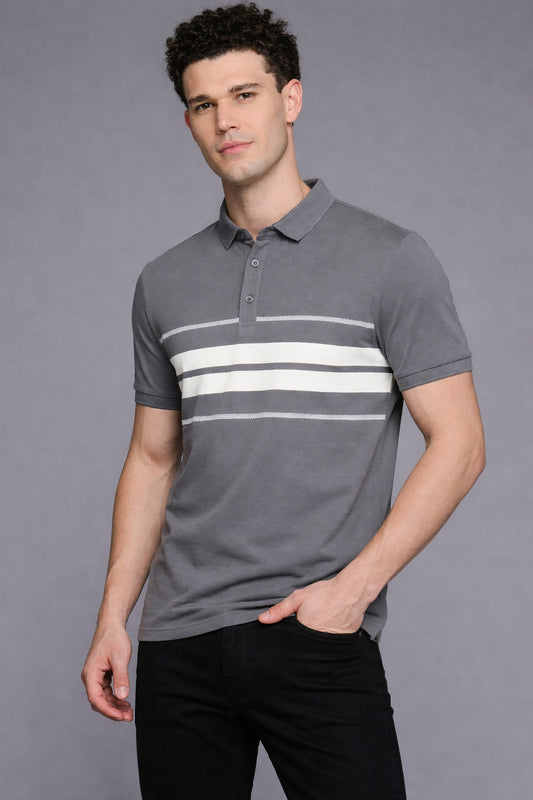 Man wearing a gray polo shirt with white stripes on a gray background