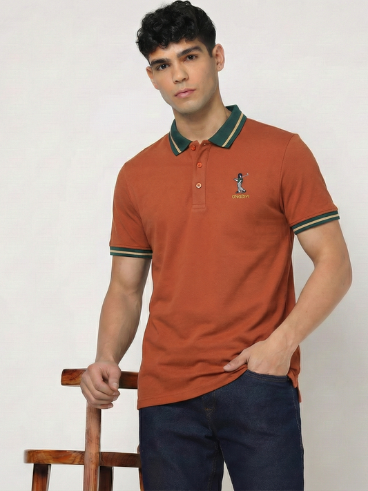Man wearing a orange polo shirt with a logo on a white background