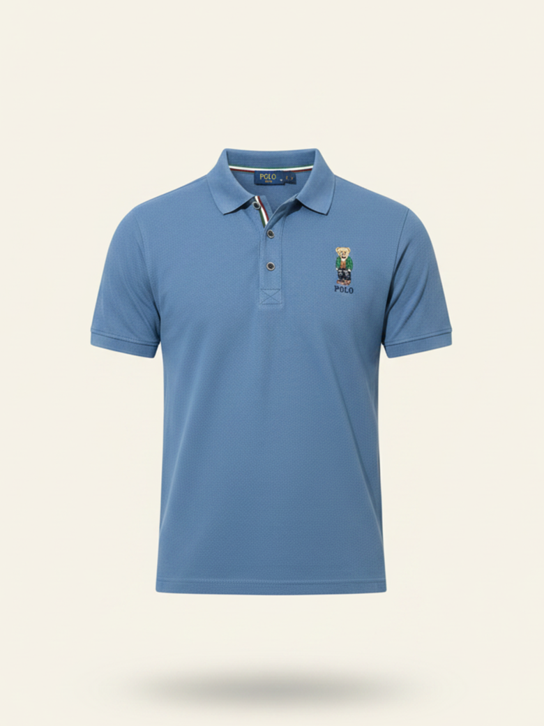 Blue polo shirt with a brand logo on a beige background