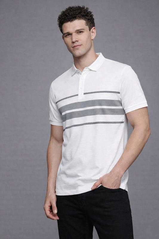 Man wearing a white polo shirt with gray stripes against a gray background