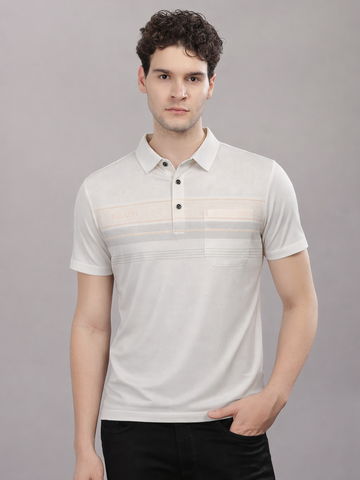 Man wearing a white polo shirt with subtle pattern against a gray background