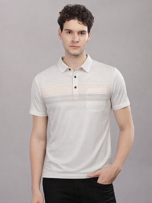 Man wearing a white polo shirt with subtle pattern against a gray background